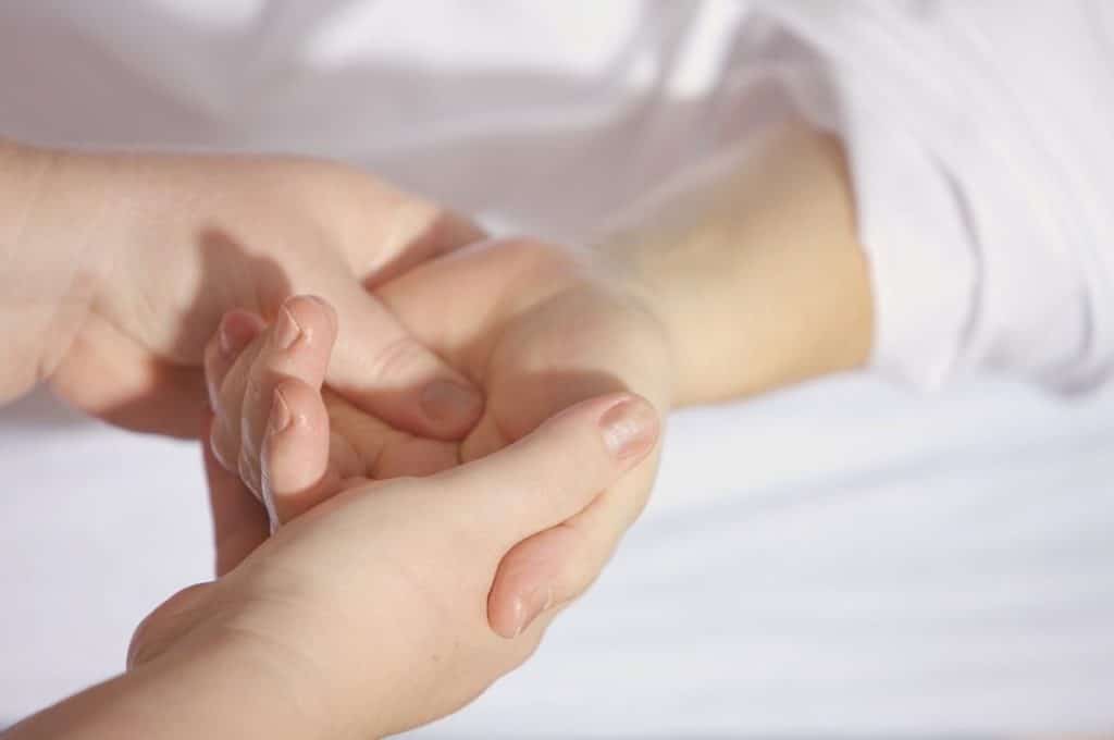 Person holding another persons hand 1024x680