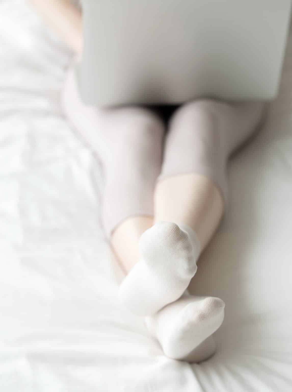 Pregnant woman working on laptop