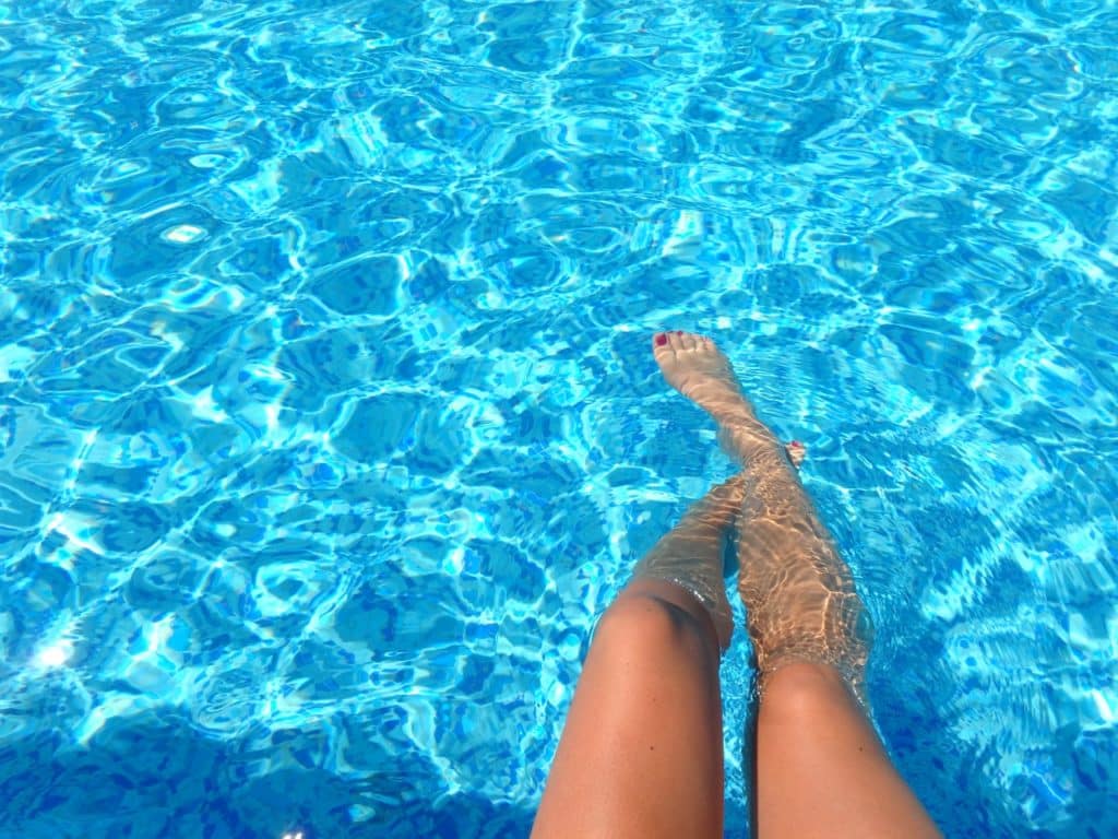 person feet dipping on pool 835240 1024x768