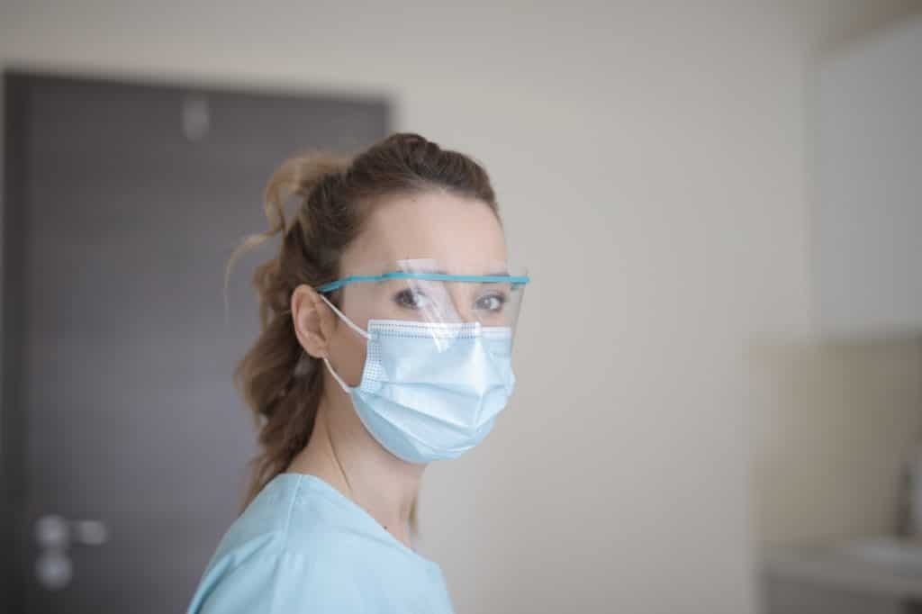 woman in blue shirt wearing face mask 3881247 1024x682